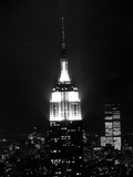 The Empire State Building Lights up at Night Photographic Print