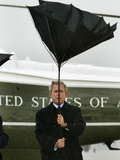 President Bush Jokingly Holds His Wind-Blown Umbrella Upright Photographic Print