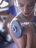 Young Woman Exercising with Dumbbells Photographic Print