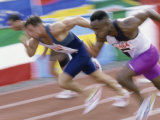 Side Profile of Three Men Running on a Running Track Photographic Print Side Profile of Three Men Running on a Running Track Photographic Print