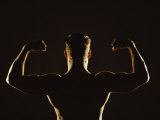 Rear View of a Young Man Flexing His Muscles Photographie