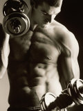 Close-up of a Young Man Working Out with Dumbbells Fotografiskt tryck