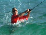 Waves Splash President-Elect George Bush as He Casts a Line While Surf-Fishing Photographic Print