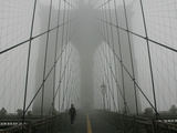 A Lone Runner Makes His Way Across the Fog-Shrouded Brooklyn Bridge Christmas Morning Photographic Print