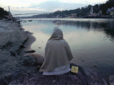 A Hindu Pilgrim Meditates Along the Bank of the Ganges River Photographic Print