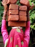 An Indian Woman Construction Worker Stacks Bricks on Her Head Photographic Print