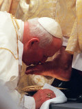 Pope John Paul II Kisses the Foot of a Clergyman Photographic Print