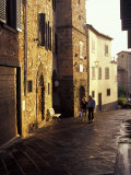 Couple Walking on Narrow Street, Radda in Chianti, Tuscany, Italy Photographic Print by John & Lisa Merrill