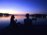 Silhouetted Couple at Dusk at Huntress Marina, Port Antonio, Jamaica Photographic Print by Holger Leue