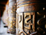 Detail of Prayer Wheels with Tibetan Pali Script, Kagbeni, Nepal Lámina fotográfica por Anthony Plummer