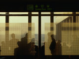 People Silhouetted in Smoking Room at Gimpo Airport, Seoul, South Korea Photographie par Johnson Dennis