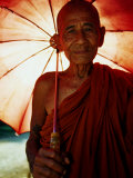 Smiling Monk Holding Umbrella, Mrauk U, Myanmar (Burma) Photographic Print by Frank Carter