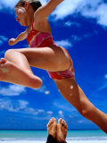 Girl Jumping Dad's Legs, Seychelles Photographic Print by Philip Smith