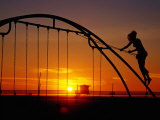 Girl on a Swing at Sunset, Venice Beach Boardwalk, Los Angeles, United States of America Photographic Print by Richard Cummins