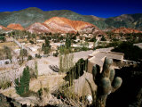 Seven Colours Hill Above Andean Village of Quebrada De Humahuaca, Purmamarca, Argentina Photographie par Michael Taylor