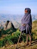 Shepherd Boy with Simien Mountains Background, Simien Mountains National Park, Ethiopia Photographic Print by Frances Linzee Gordon