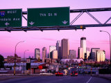 Traffic Signs Over Highway with City Skyline Beyond at Dusk, Minneapolis, United States of America Photographic Print by Richard Cummins