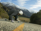 Man Going Down Hill on Longboard Skate, Treble Cone, Wanaka, New Zealand Fotografie-Druck von Christian Aslund