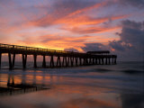 Pier at Sunrise with Reflections of Clouds on Beach, Tybee Island, Georgia, USA Photographic Print by Joanne Wells