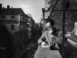 French Writer Albert Camus Smoking Cigarette on Balcony Outside His Publishing Firm Office Premium Photographic Print by Loomis Dean