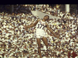Greg Bell Competing in the Long Jump at the Summer Olympics Premium Photographic Print by John Dominis