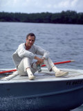 Actor Paul Newman Enjoying a Heineken Beer on the Prow of a Boat Premium Photographic Print by Mark Kauffman