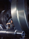 Man Dwarfed by Gigantic Gears He is Working on for the Navy, at General Electric Plant in US Premium Photographic Print by Dmitri Kessel