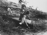 Marine Pfc. Raymond Hubert Using Unexploded 16 Inch Naval Shell for Resting Place during WWII Premium Photographic Print by A.b. Knight