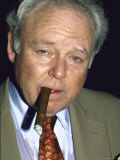 Actor Carroll O'Connor, Smoking Cigar Premium Photographic Print by David Mcgough