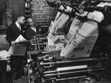 Newspaper Founder Robert S. Abbott Checking Printing Press at the African American Newspaper Photographie par Gordon Coster