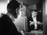 Composer/Conductor Leonard Bernstein Looking in Mirror before conducting Concert at Carnegie Hall Premium Photographic Print by Alfred Eisenstaedt
