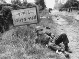American Soldier Elmer Habbs of Delaware Resting as Troops Advance in Allied Invasion of Normandy Premium Photographic Print by Bob Landry