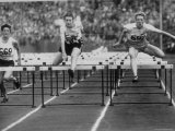 US Runner Fanny Blankers Koen Setting Olympic Record of 11.2 Seconds in 80 Meter Hurdles Premium Photographic Print by Mark Kauffman