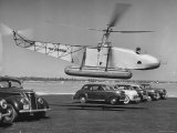 Igor Sikorsky Taking Off in Helicopter from Parking Lot Premium Photographic Print by Dmitri Kessel