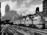 New York Central Passenger Train with a Streamlined Locomotive Leaving Chicago Station Photographie par Andreas Feininger