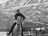 Actor Robert Redford Exercising One of His Eight Saddle Horses on His Remote Mountain Ranch Premium Photographic Print by John Dominis