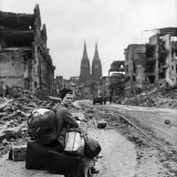 Homeless Refugee German Woman Sitting with All Her Worldly Possessions on Side of a Muddy Street Photographic Print by John Florea