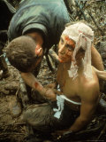 Wounded Marine Being Bandaged in Muddy Jungle During OP Prairie US Military Sweep South of DMZ Premium Photographic Print by Larry Burrows