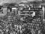 Cellarman at Giannino's Handing Bottle of Wine to Waiter for His Customers Photographic Print by Alfred Eisenstaedt