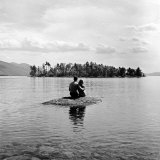 Young Couple Embracing on Small Rock Protruding from the Waters of Lake George Photographic Print by Nina Leen