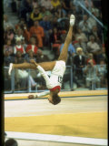 US Gymnast Ludmila Turishcheva Performing a Floor Exercise During the Summer Olympics Premium Photographic Print by John Dominis
