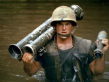 American Marine Pfc. Phillip Wilson Carrying Bazooka Across Stream Near DMZ During Vietnam War Premium Photographic Print by Larry Burrows