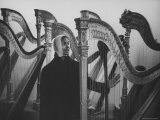 Actress Marpessa Dawn Looking at Harps in Store Reproduction photographique sur papier de qualité par Loomis Dean