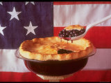 Deep Dish Blueberry Pie, with a scoop in front of the American Flag Photographic Print by Fred Lyon