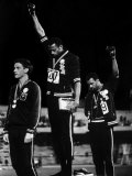 African American Track Star Tommie Smith, John Carlos After Winning Gold and Bronze Olympic Medal Reproduction photographique sur papier de qualité par John Dominis