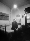 Author William Burroughs, an Ex Dope Addict, Relaxing on a Shabby Bed in a "Beat Hotel" Premium Photographic Print by Loomis Dean