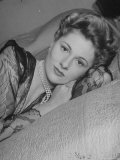Actress Joan Fontaine Wearing Sheer Negligee While Lounging on Bed at Home Premium Photographic Print by Bob Landry