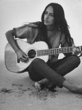 Folk Singer Joan Baez Strumming Her Guitar on the Beach Near Her Home Reproduction photographique sur papier de qualité par Ralph Crane
