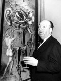 Film Director Alfred Hitchcock, Standing Beside Salvador Dali's Painting "Movies" Premium Photographic Print by Herbert Gehr