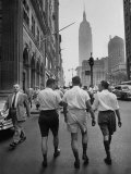 Three Young Businessmen Wearing Bermuda Shorts as They Walk Along Fifth Ave. During Lunchtime Premium Photographic Print by Lisa Larsen